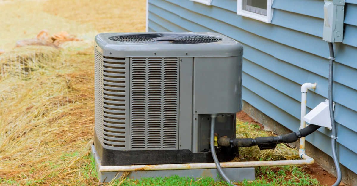 Technician inspecting a home furnace unit