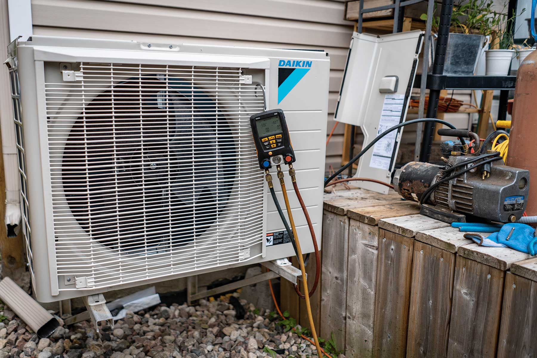 Technician performing AC maintenance before winter in Los Angeles home
