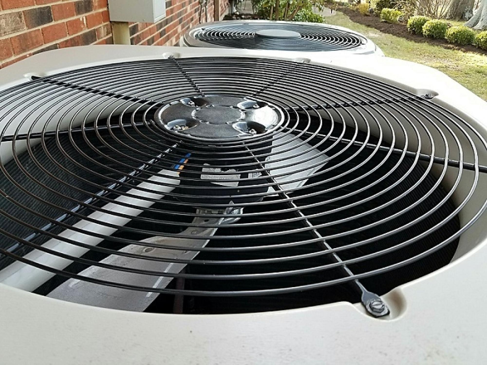 HVAC technician inspecting ducts for mold during autumn